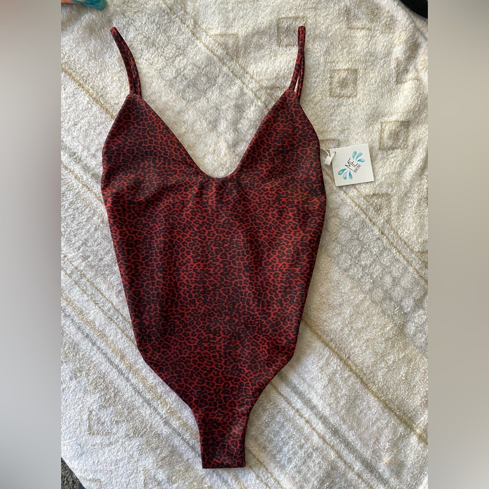 Cheeky one piece bikini! Size small fits like XS. Super cute, but did not fit me